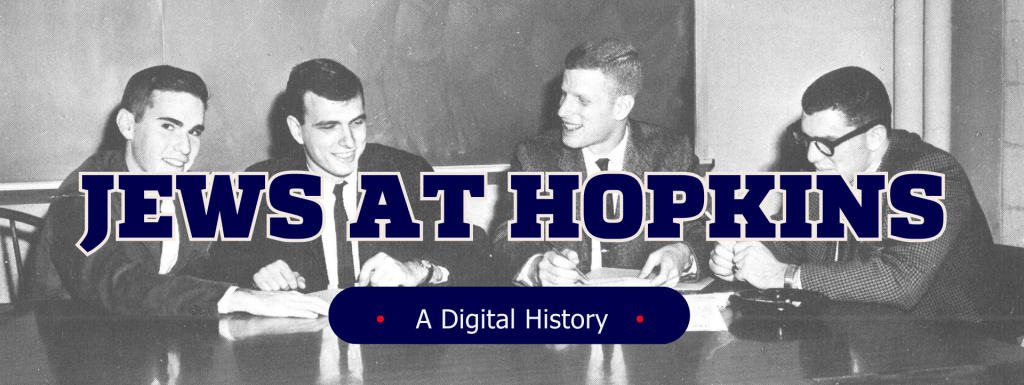 Four fair skinned students sit at a wooden table, all smiling in as the converse with one another. Overlaid is stylized text that says Jews at Hopkins A Digital History.