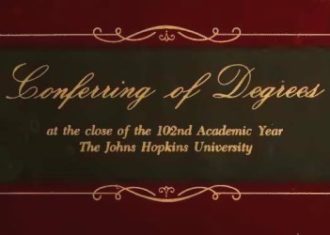 In fancy script "Conferring of Degrees" and in regular type "at the close of the 102nd Academic Year The Johns Hopkins University".
