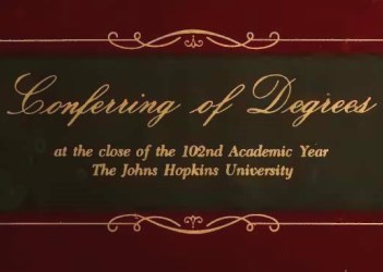 In fancy script "Conferring of Degrees" and in regular type "at the close of the 102nd Academic Year The Johns Hopkins University".