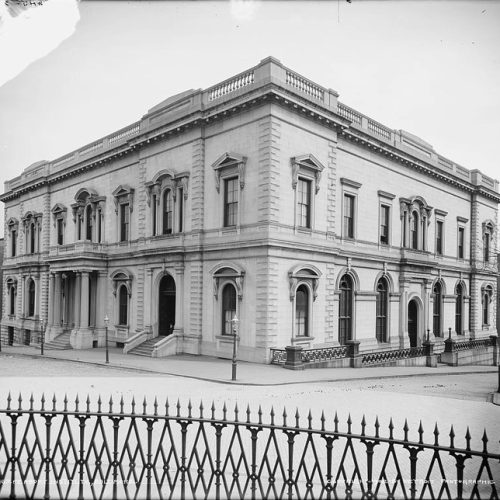 A black and white photograph of the peabody building, a two story stone building.