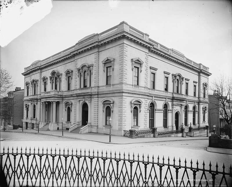 A black and white photograph of the peabody building, a two story stone building.
